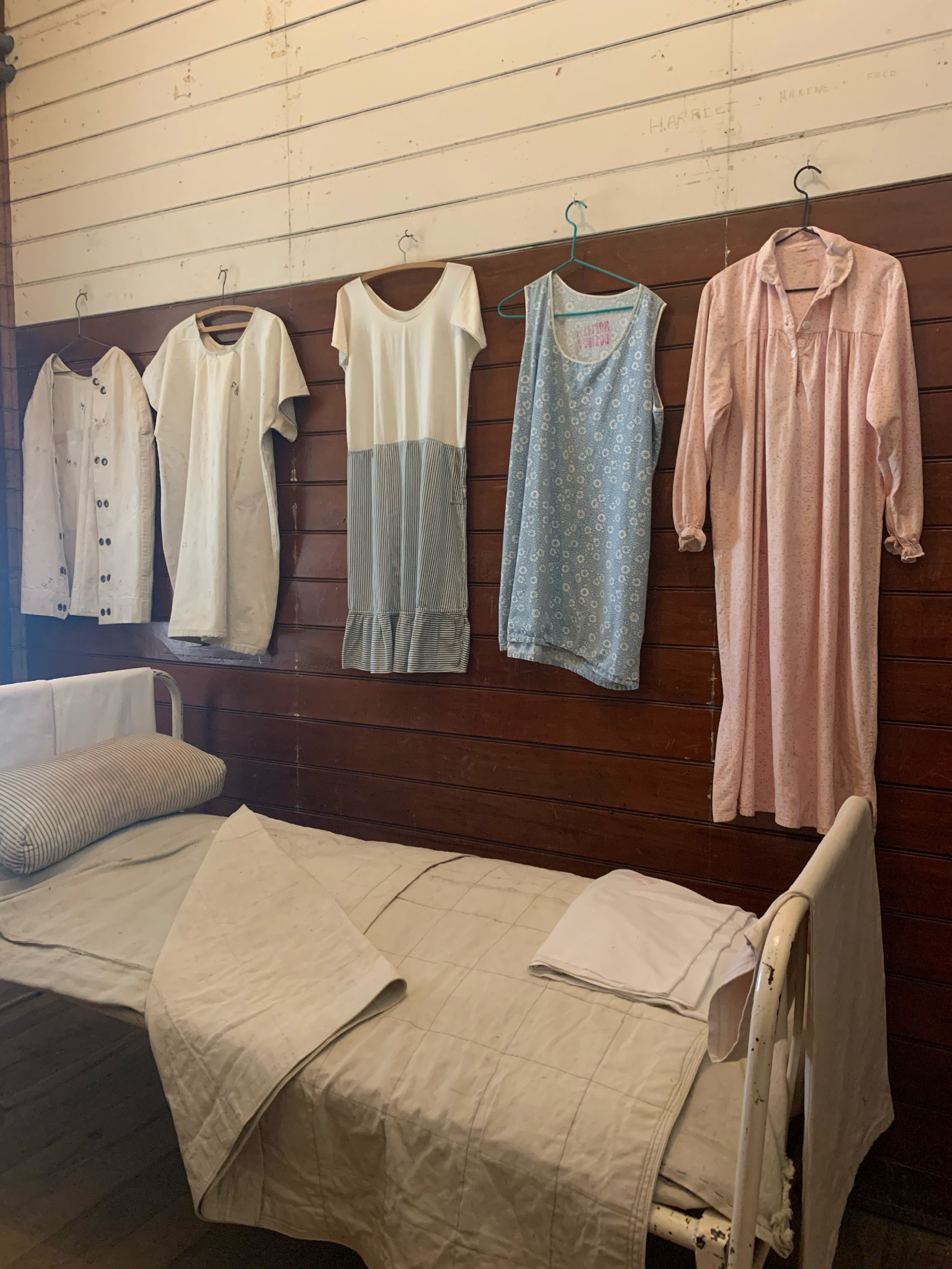 Womens clothing hangs on wall