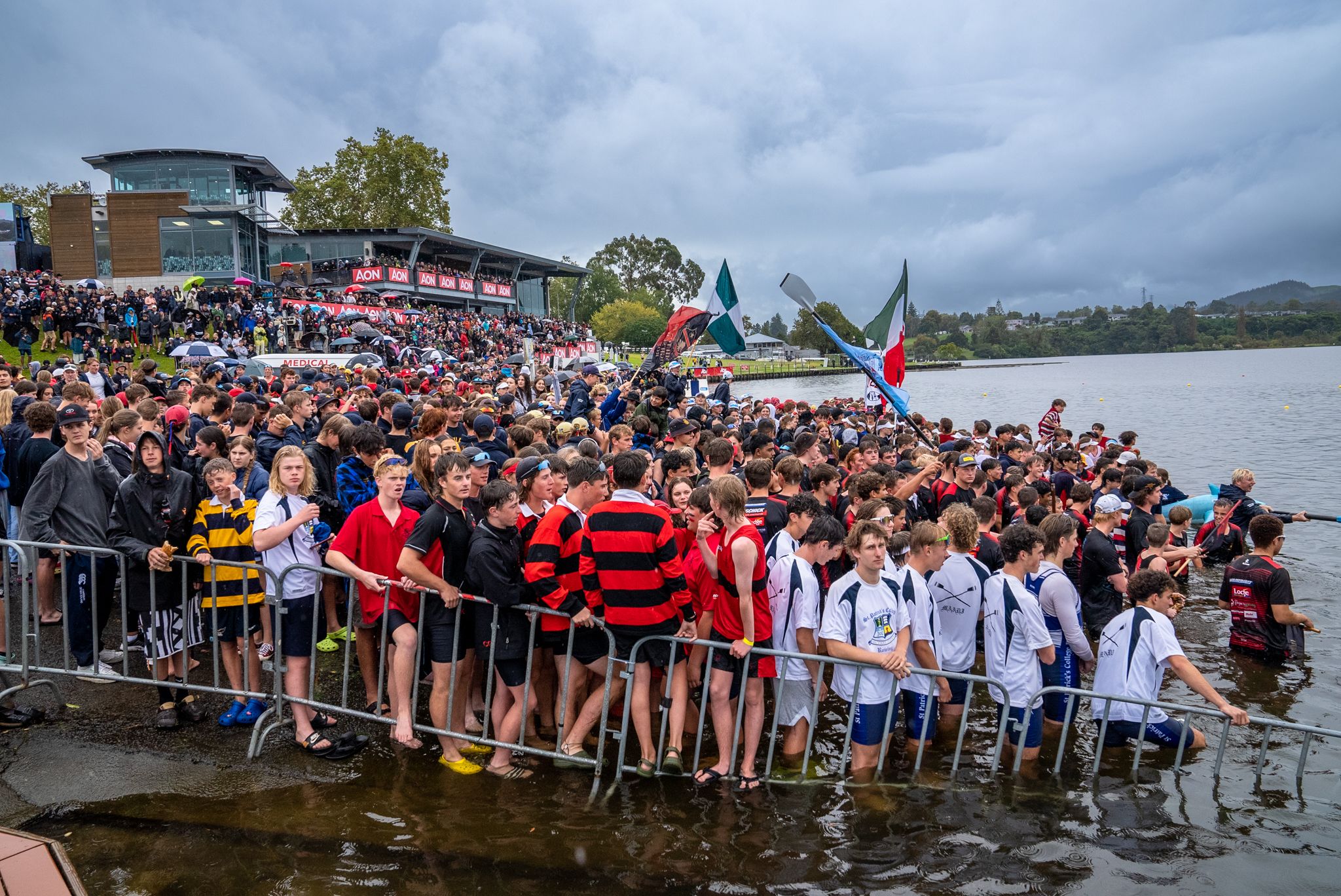 Fans wait at waters edge for winning boats