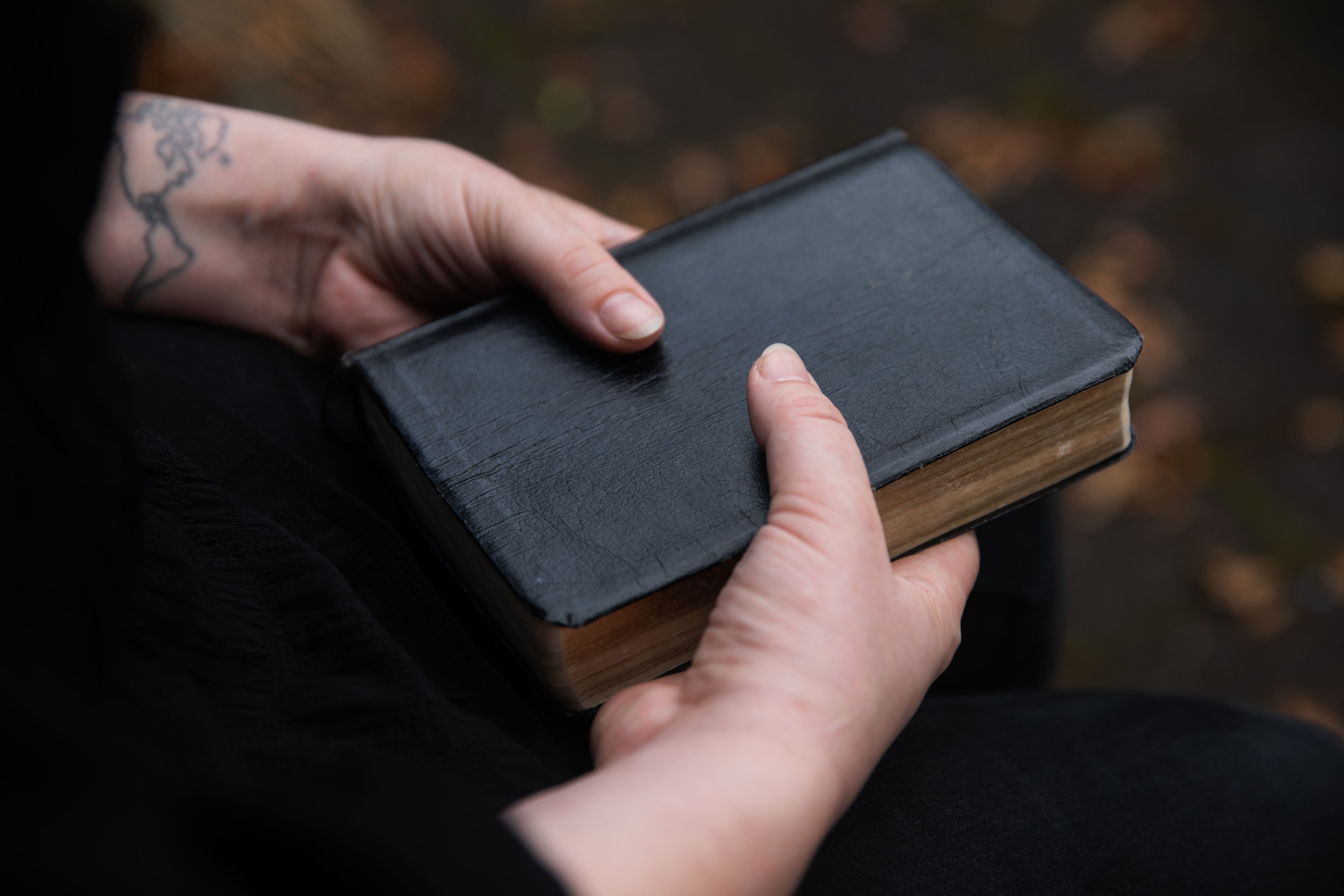 Hands holding a Bible